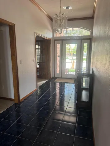 a view of entryway and hall with a front door