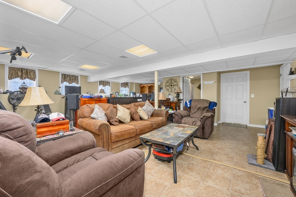 138 Sprague Street Fall River, MA 02724 - Photo 19 of 34 a living room with furniture and a lamp