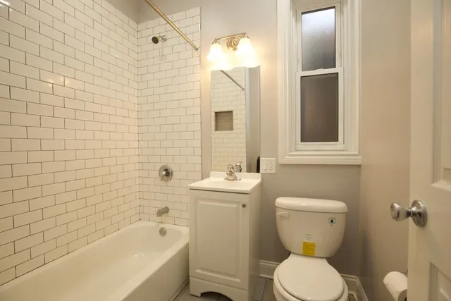 a bathroom with a toilet sink and bathtub