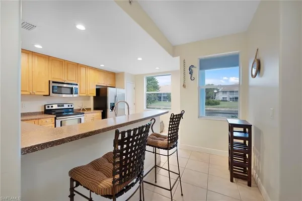 $339,000 | 1128 Manor Lake Drive, Unit G103, Naples, FL 34110