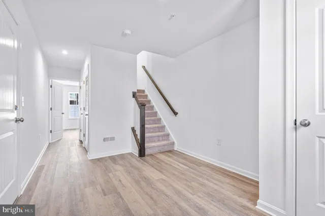 a view of an entryway with wooden floor