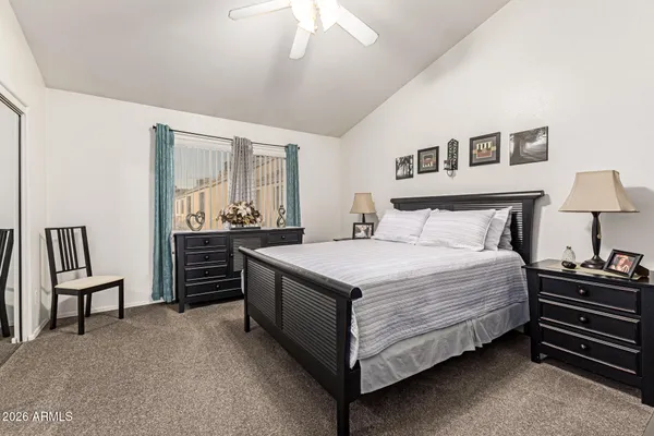 a bedroom with a bed and dresser