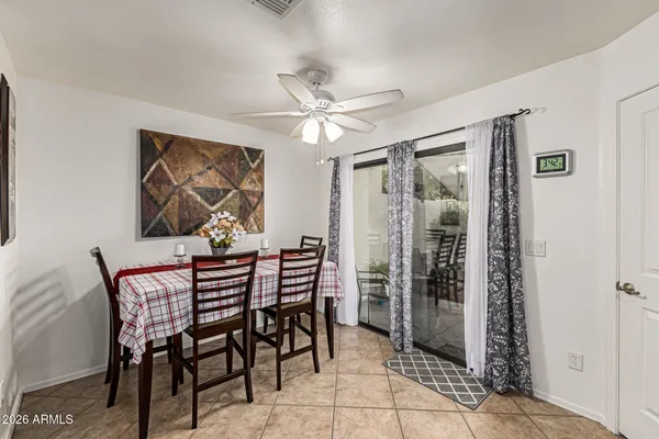 a dining room with furniture and window