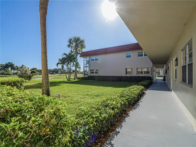 a kitchen with a refrigerator sink and cabinets