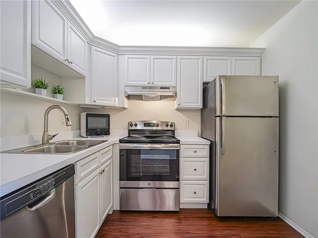 a living room with furniture a window and a table