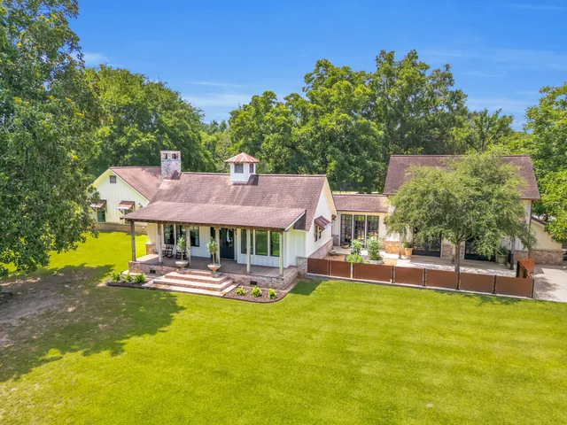 a front view of a house with a big yard