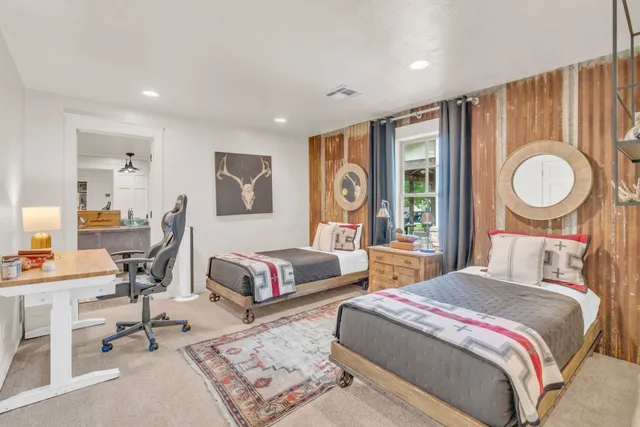 a bathroom with a sink a vanity a mirror a vanity and a shower