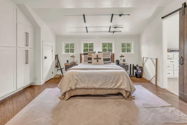 a view of a patio with couches chairs potted plants and a yard