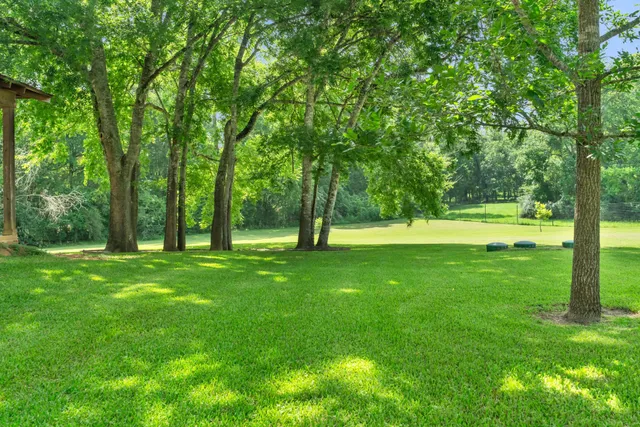 a view of a swimming pool with an outdoor space and seating area