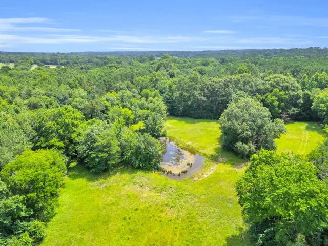 a view of a swimming pool with a table and chairs