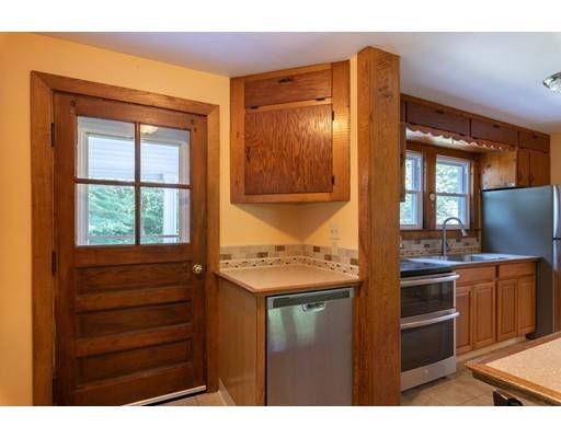 72 Spring Street Northampton, MA 01062 - Photo 14 of 39 a kitchen with a stove and a wooden cabinets
