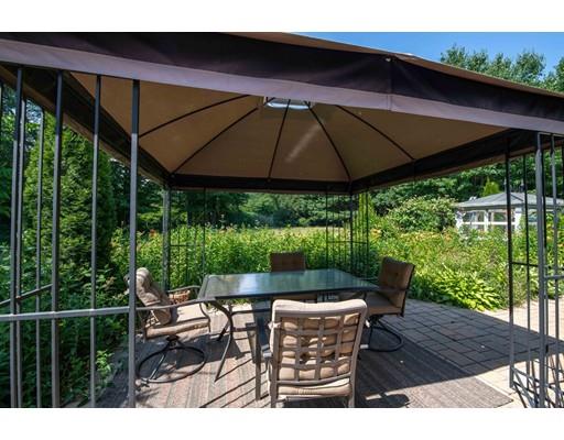 72 Spring Street Northampton, MA 01062 - Photo 38 of 39 a patio with wooden floor a yard tables and chairs