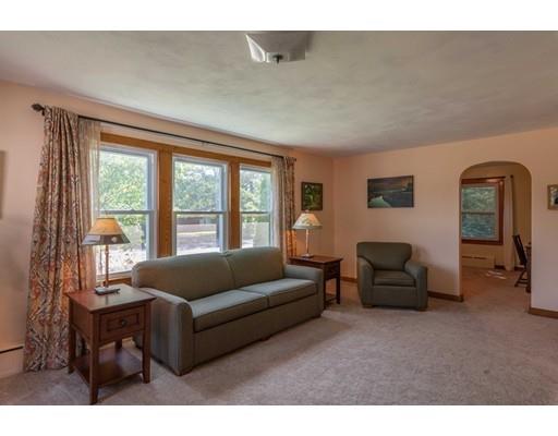 72 Spring Street Northampton, MA 01062 - Photo 6 of 39 a living room with furniture and a large window