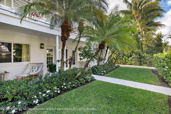 a view of a house with a yard and plants