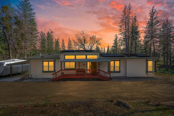 a front view of house with yard and outdoor space