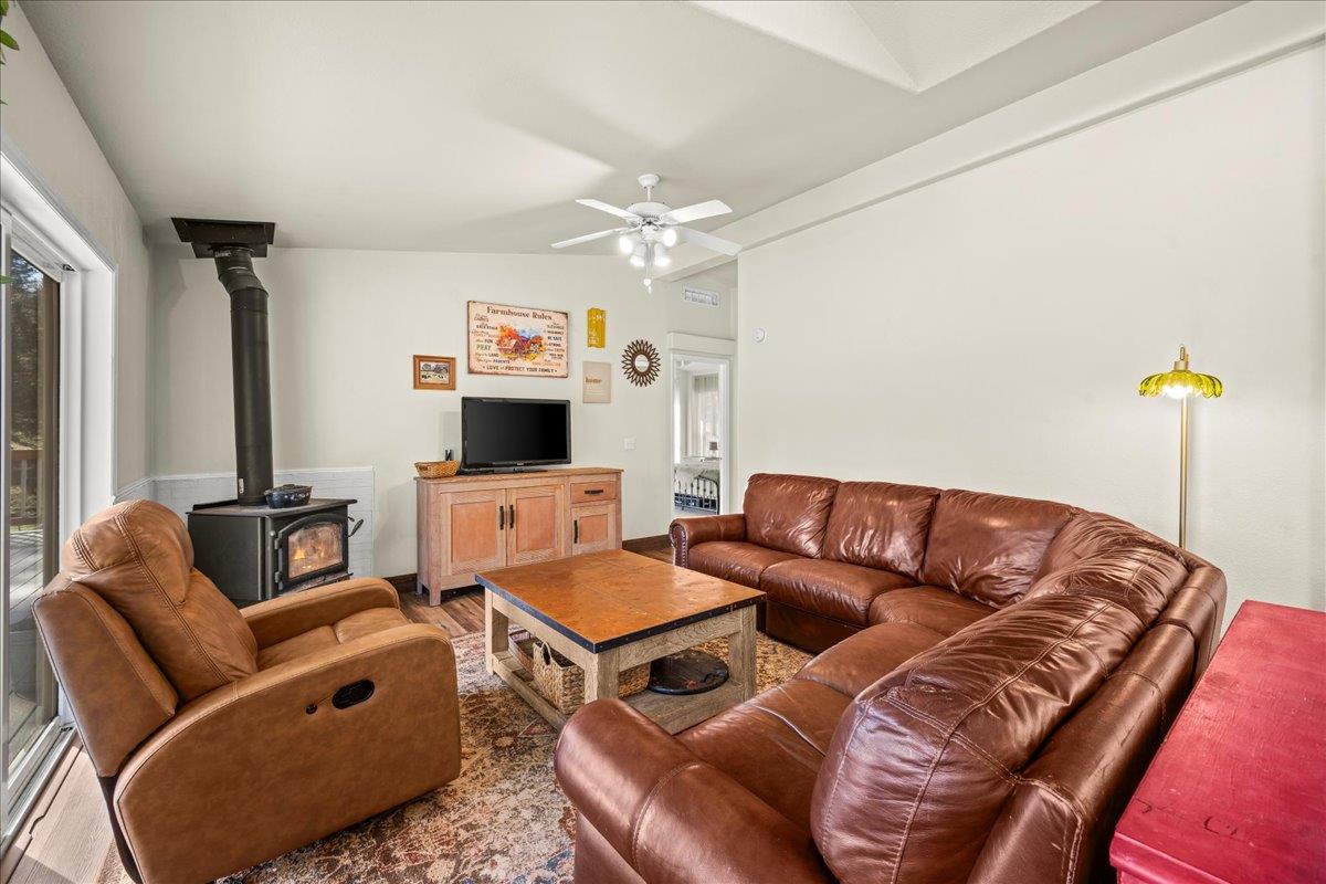 5351 Cosumnes Mine Road Somerset, CA 95684 - Photo 19 of 66 a living room with furniture a flat screen tv and a couch