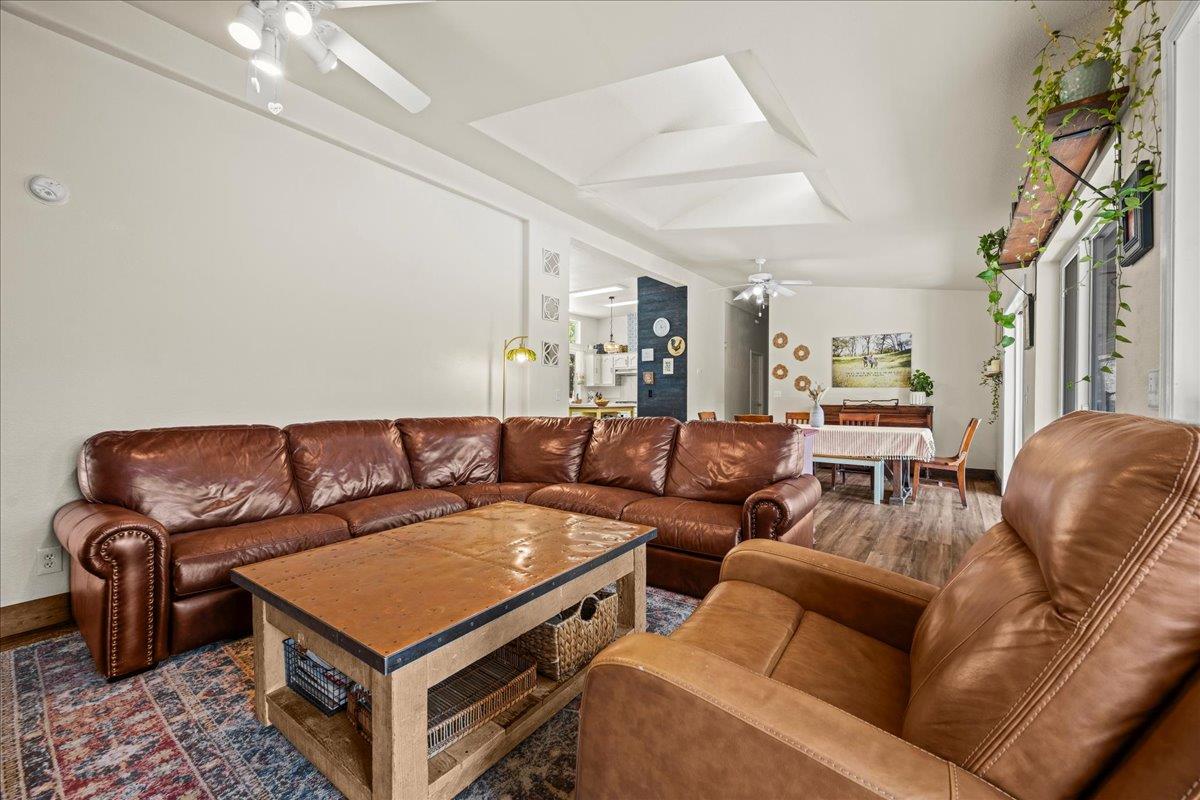 5351 Cosumnes Mine Road Somerset, CA 95684 - Photo 25 of 66 a living room with furniture and a chandelier