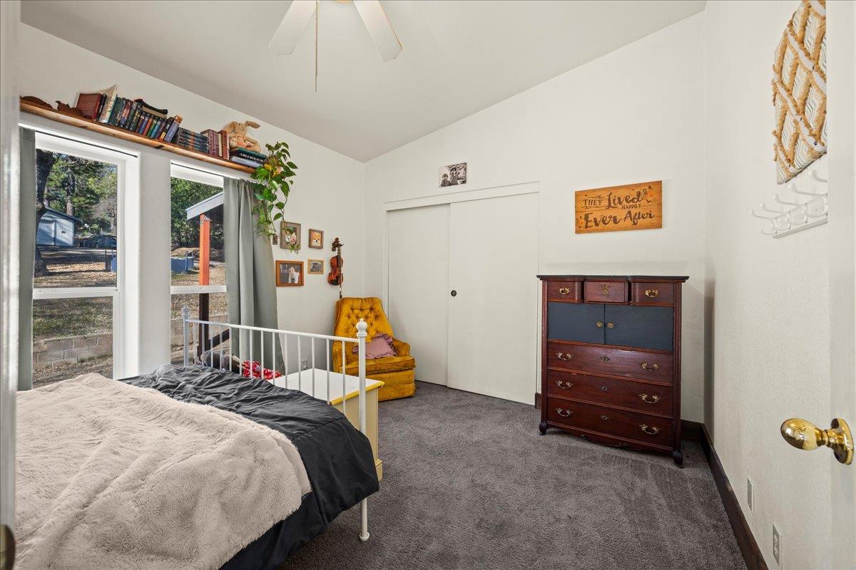 5351 Cosumnes Mine Road Somerset, CA 95684 - Photo 26 of 66 a bedroom with bed and a window