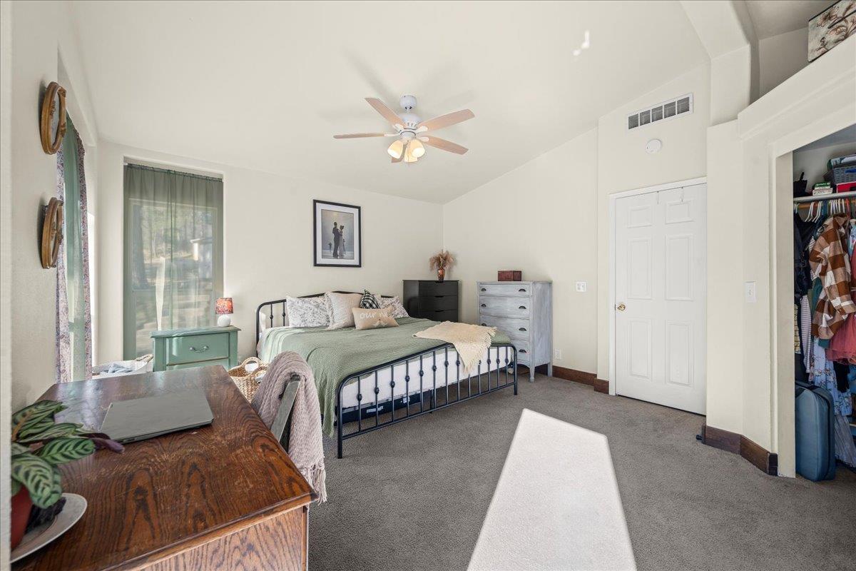 5351 Cosumnes Mine Road Somerset, CA 95684 - Photo 31 of 66 a bedroom with a large bed couch and a window