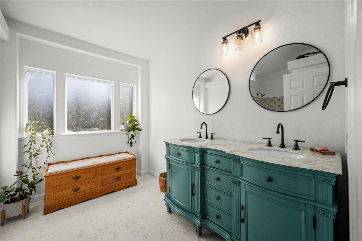 5351 Cosumnes Mine Road Somerset, CA 95684 - Photo 35 of 66 a bathroom with a double vanity sink and a mirror