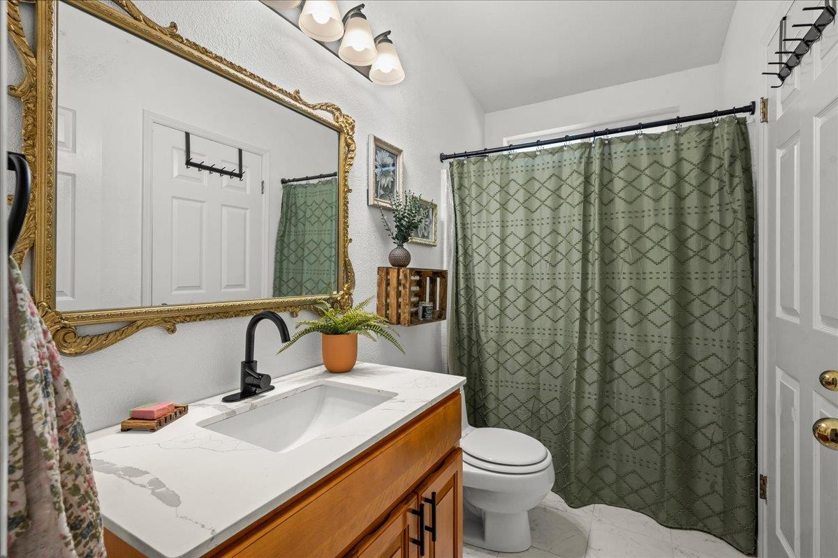 5351 Cosumnes Mine Road Somerset, CA 95684 - Photo 37 of 66 a bathroom with a sink toilet and shower