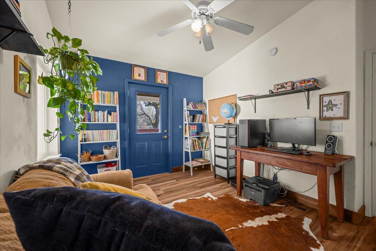 5351 Cosumnes Mine Road Somerset, CA 95684 - Photo 40 of 66 a bedroom with a bed table and a flat screen tv