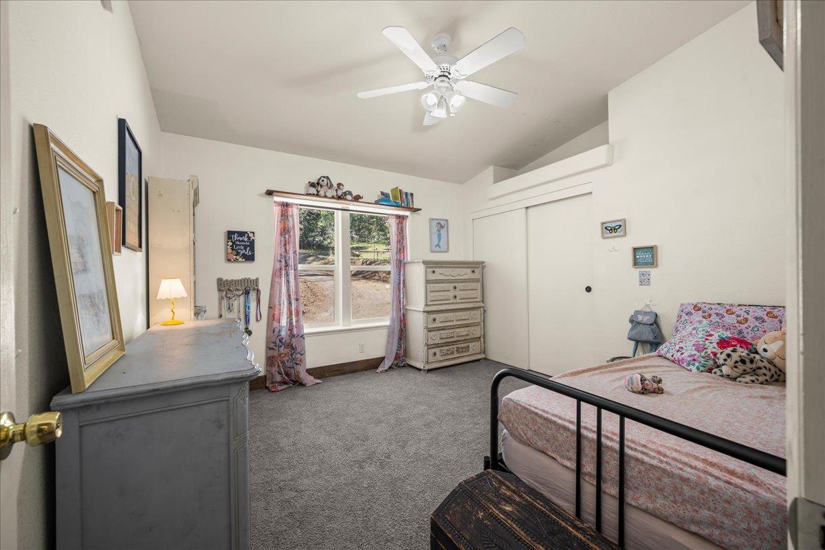 5351 Cosumnes Mine Road Somerset, CA 95684 - Photo 41 of 66 a bedroom with furniture and a window