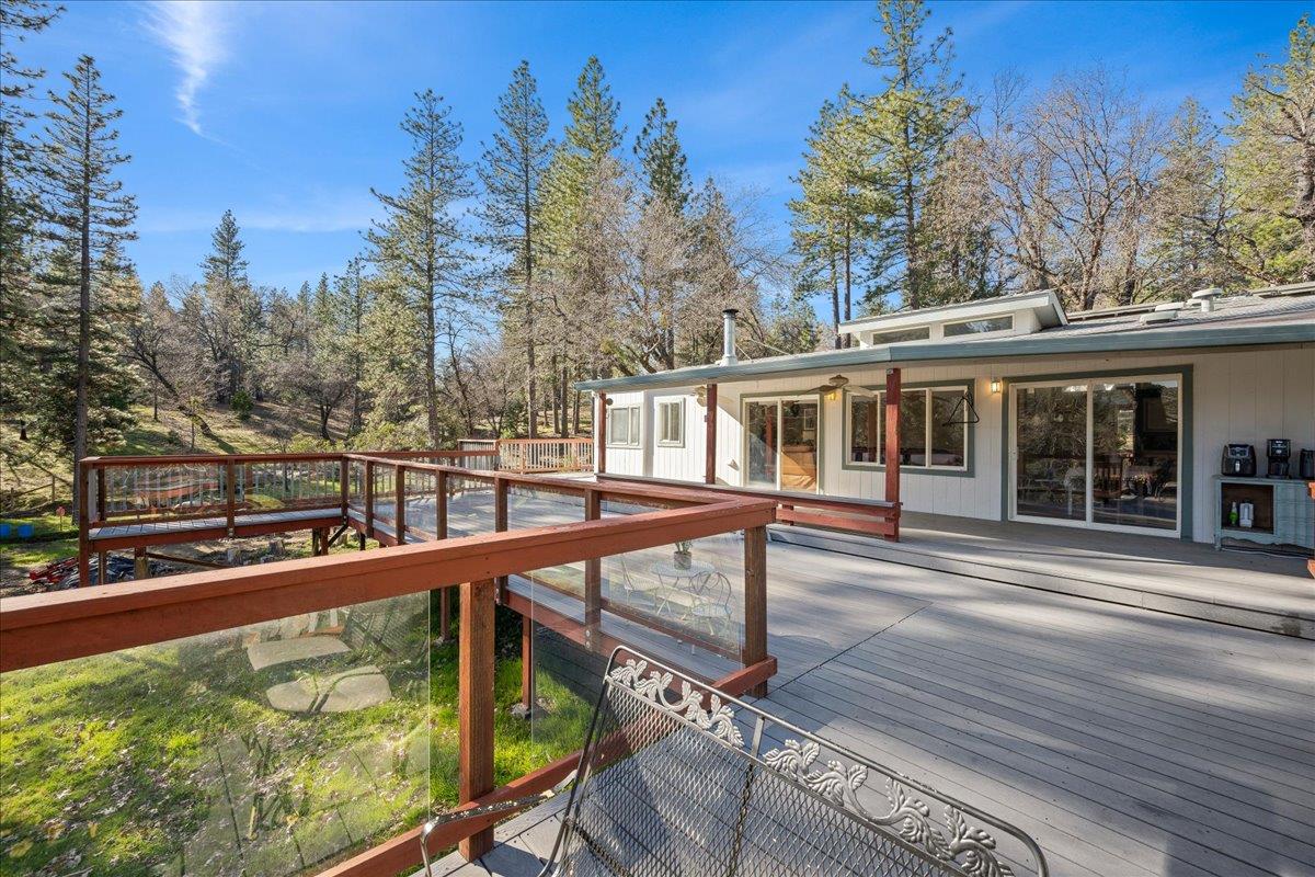 5351 Cosumnes Mine Road Somerset, CA 95684 - Photo 46 of 66 a view of a house with wooden stairs next to a road
