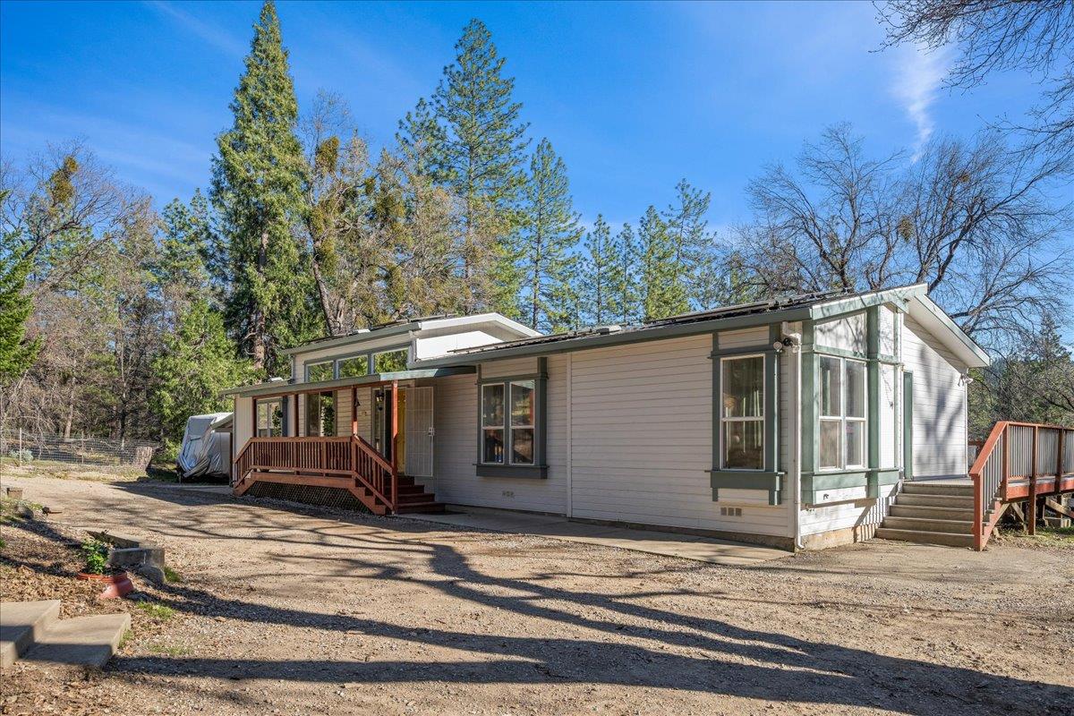 5351 Cosumnes Mine Road Somerset, CA 95684 - Photo 48 of 66 a view of a house with a garden