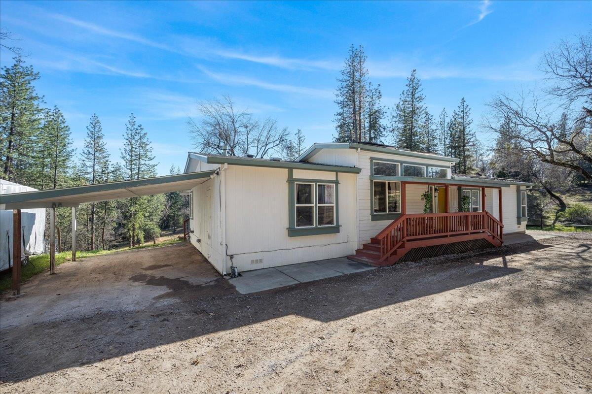5351 Cosumnes Mine Road Somerset, CA 95684 - Photo 51 of 66 a view of a house with a yard and wooden fence