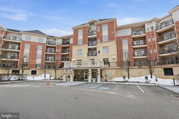 a city street lined with buildings and next to a road