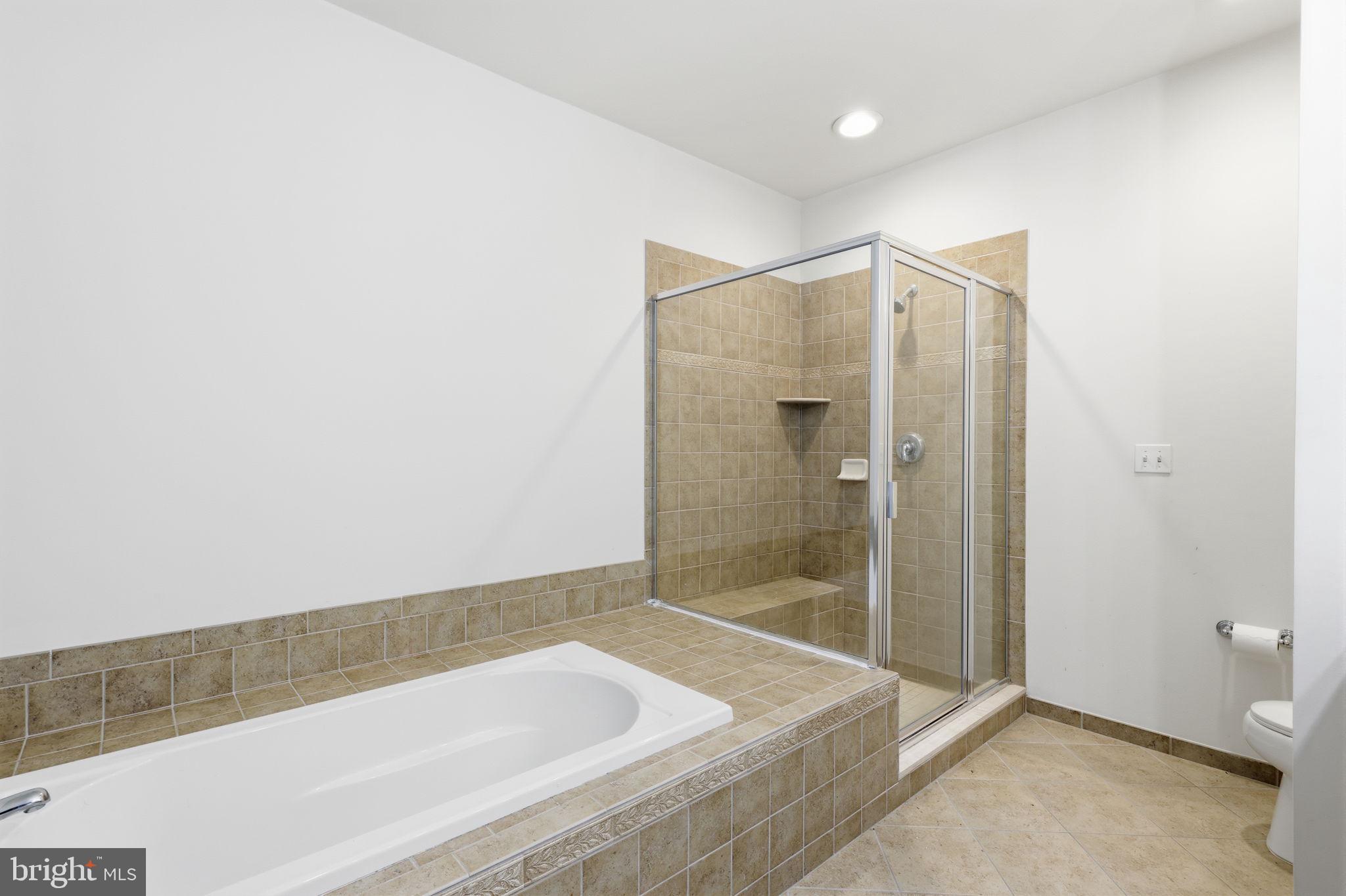 556 Carson Terrace Huntingdon Valley, PA 19006 - Photo 15 of 42 a bathroom with a bathtub and a shower