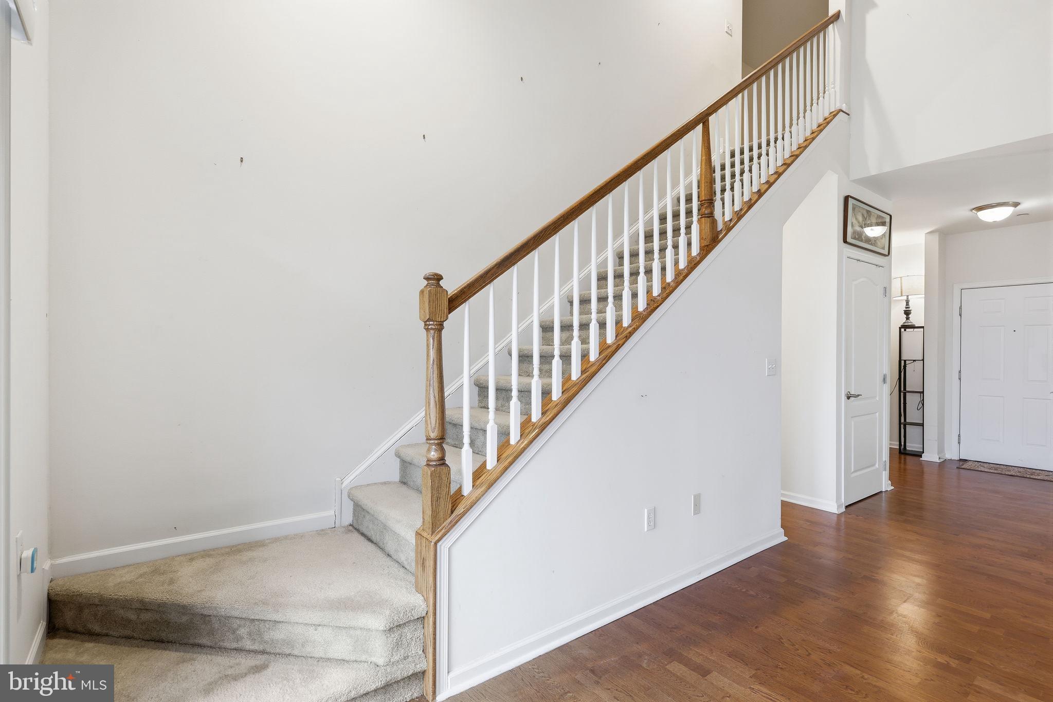 556 Carson Terrace Huntingdon Valley, PA 19006 - Photo 21 of 42 a view of staircase with wooden floor and a rug