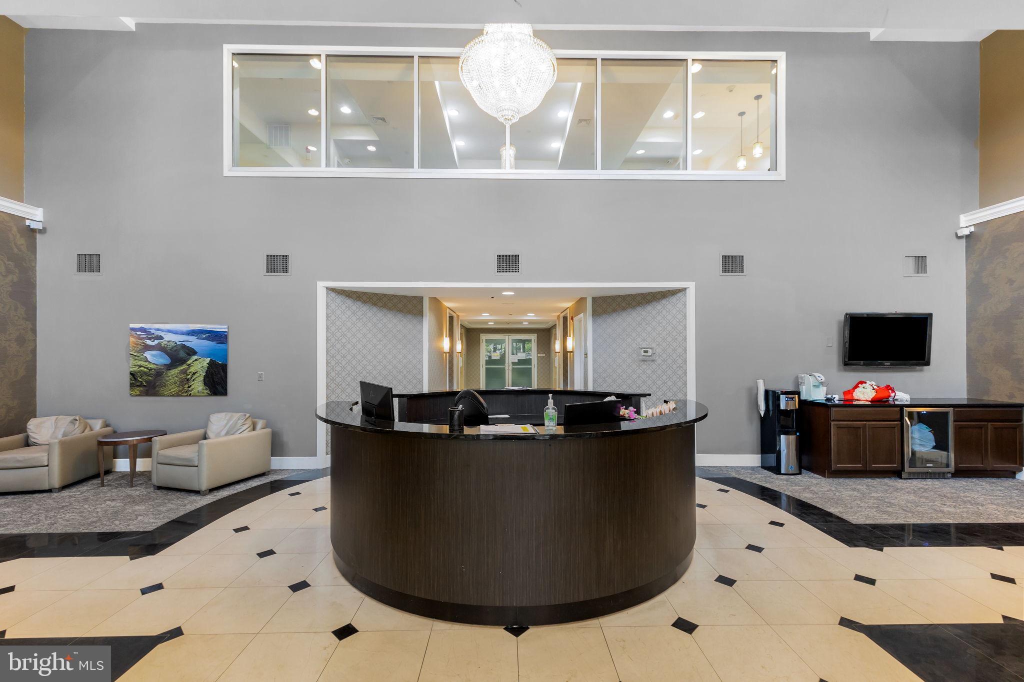 556 Carson Terrace Huntingdon Valley, PA 19006 - Photo 29 of 42 a living room with furniture and a flat screen tv