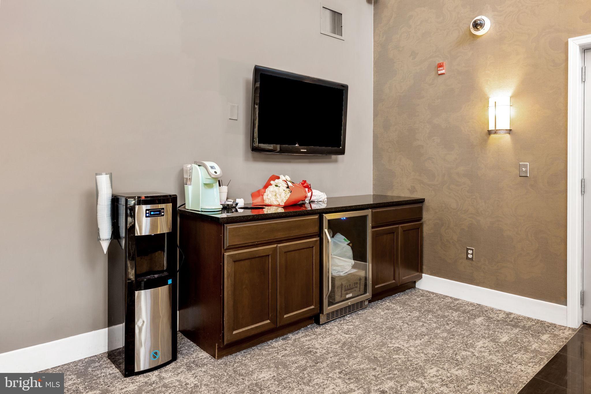 556 Carson Terrace Huntingdon Valley, PA 19006 - Photo 37 of 42 a living room with furniture and a flat screen tv