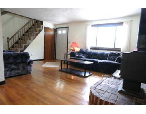 13 Rickey Drive Maynard, MA 01754 - Photo 5 of 15 a living room with furniture and a couch