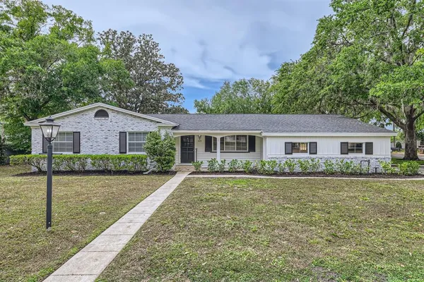 a front view of a house with yard