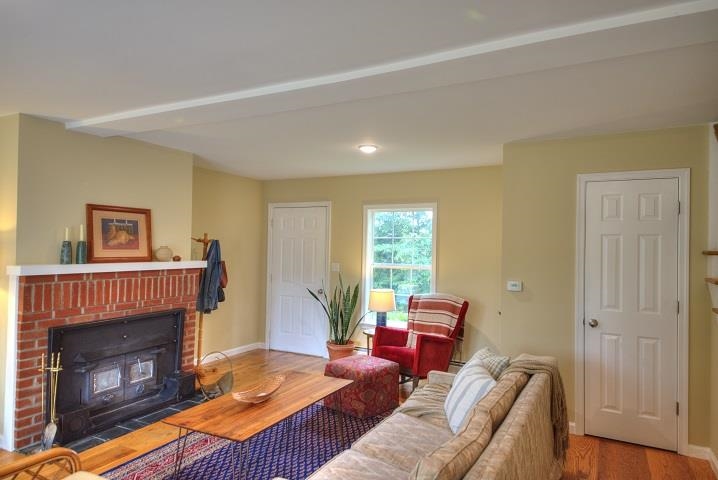 670 Rockfish Road Waynesboro, VA 22980 - Photo 36 of 58 a living room with furniture and a fireplace