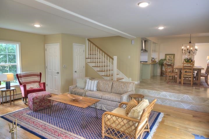 670 Rockfish Road Waynesboro, VA 22980 - Photo 37 of 58 a living room with furniture and a dining table with wooden floor