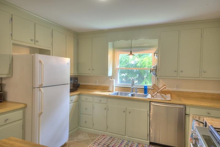 670 Rockfish Road Waynesboro, VA 22980 - Photo 38 of 58 a white refrigerator freezer sitting in a kitchen