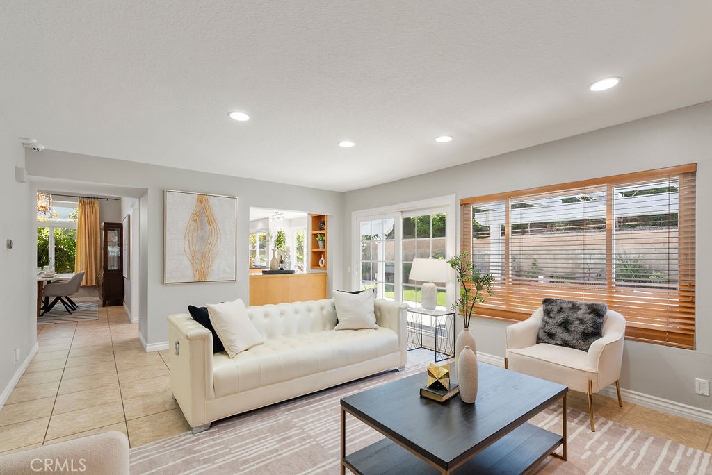 8 Ticonderoga Irvine, CA 92620 - Photo 20 of 38 a living room with fireplace furniture and floor to ceiling window
