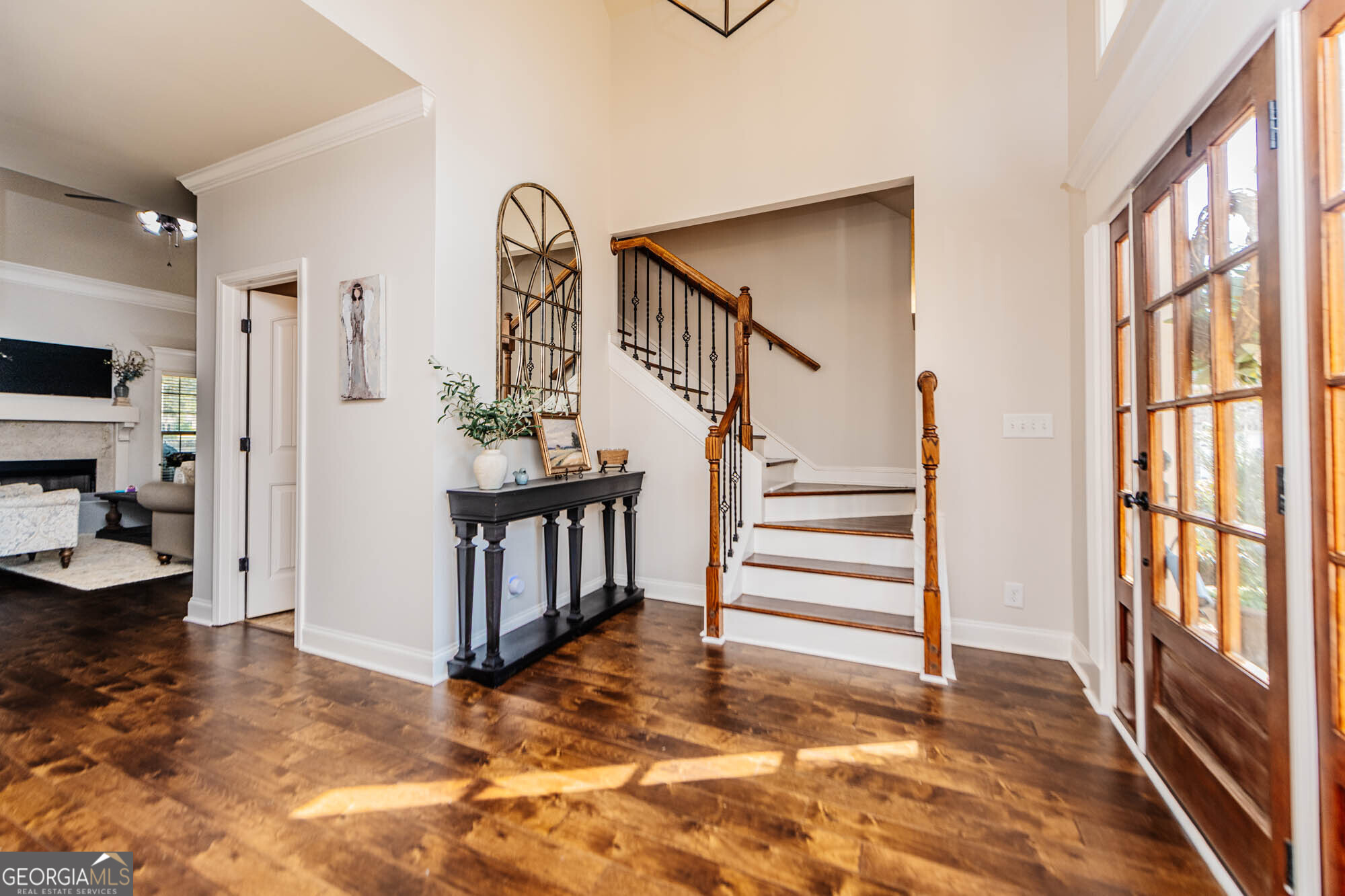 112 Bainbridge Lane Perry, GA 31069 - Photo 13 of 34 a view of entryway livingroom and hall with wooden floor
