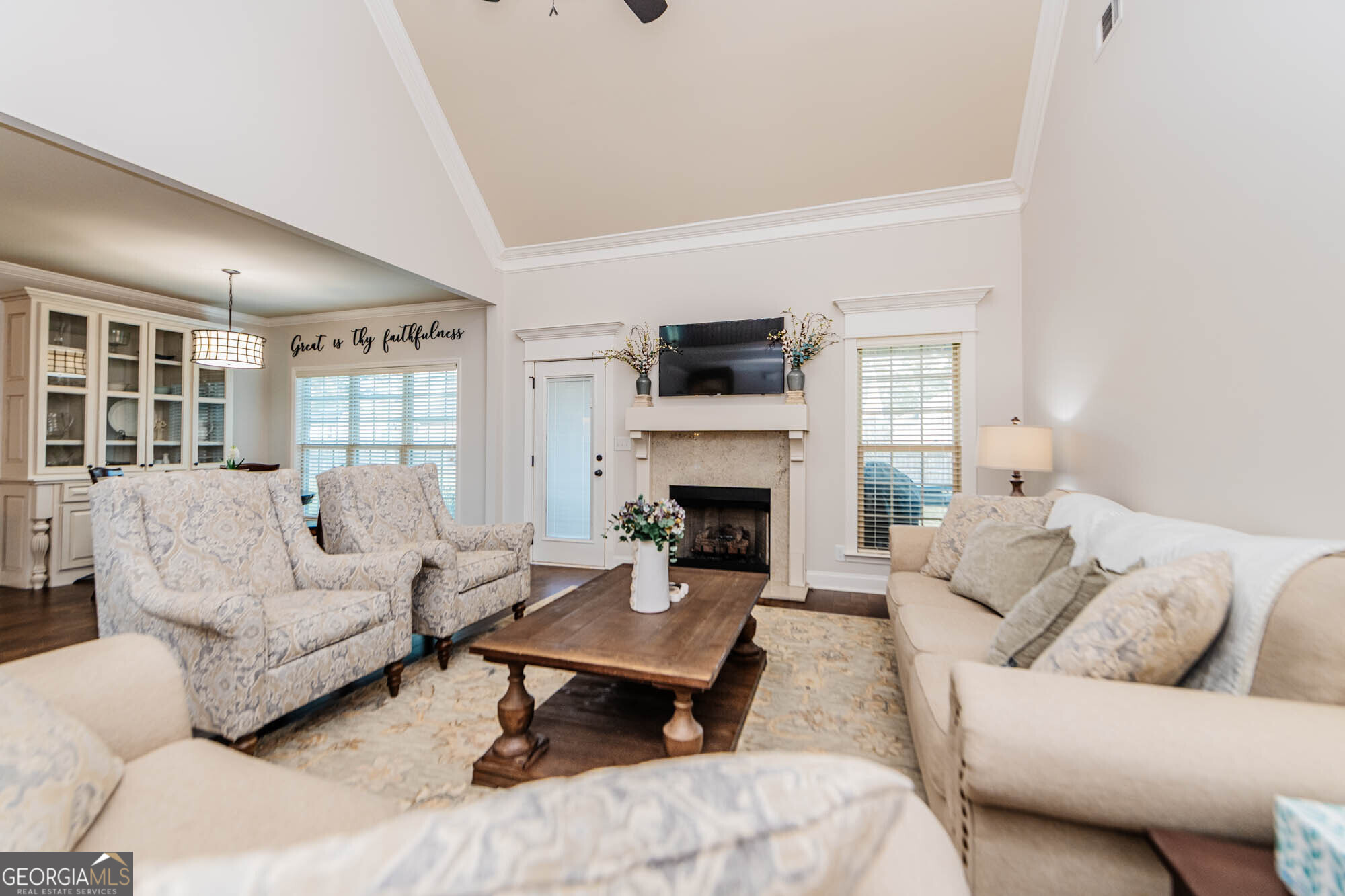 112 Bainbridge Lane Perry, GA 31069 - Photo 14 of 34 a living room with furniture a fireplace and a flat screen tv