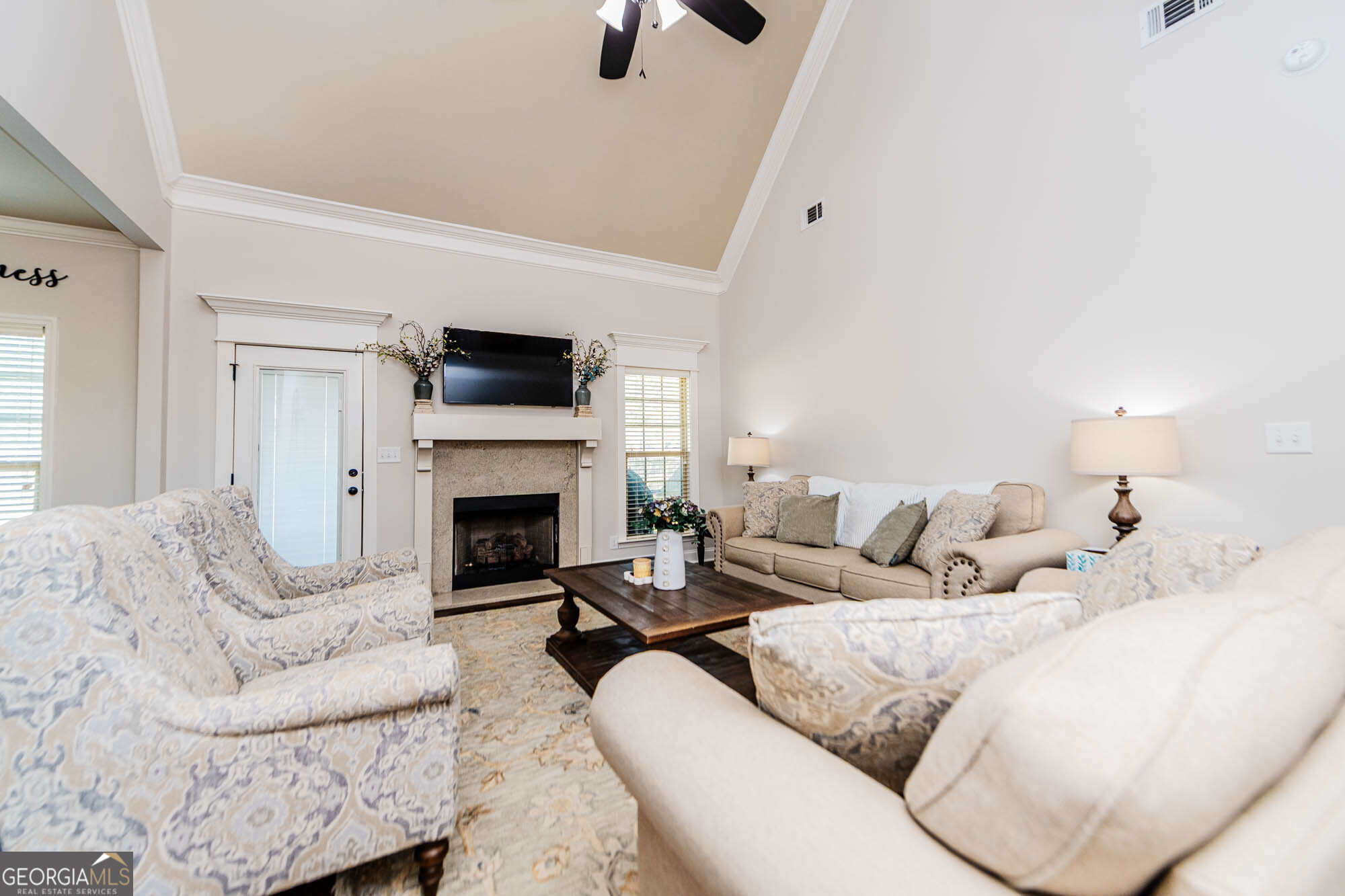 112 Bainbridge Lane Perry, GA 31069 - Photo 15 of 34 a living room with furniture a fireplace