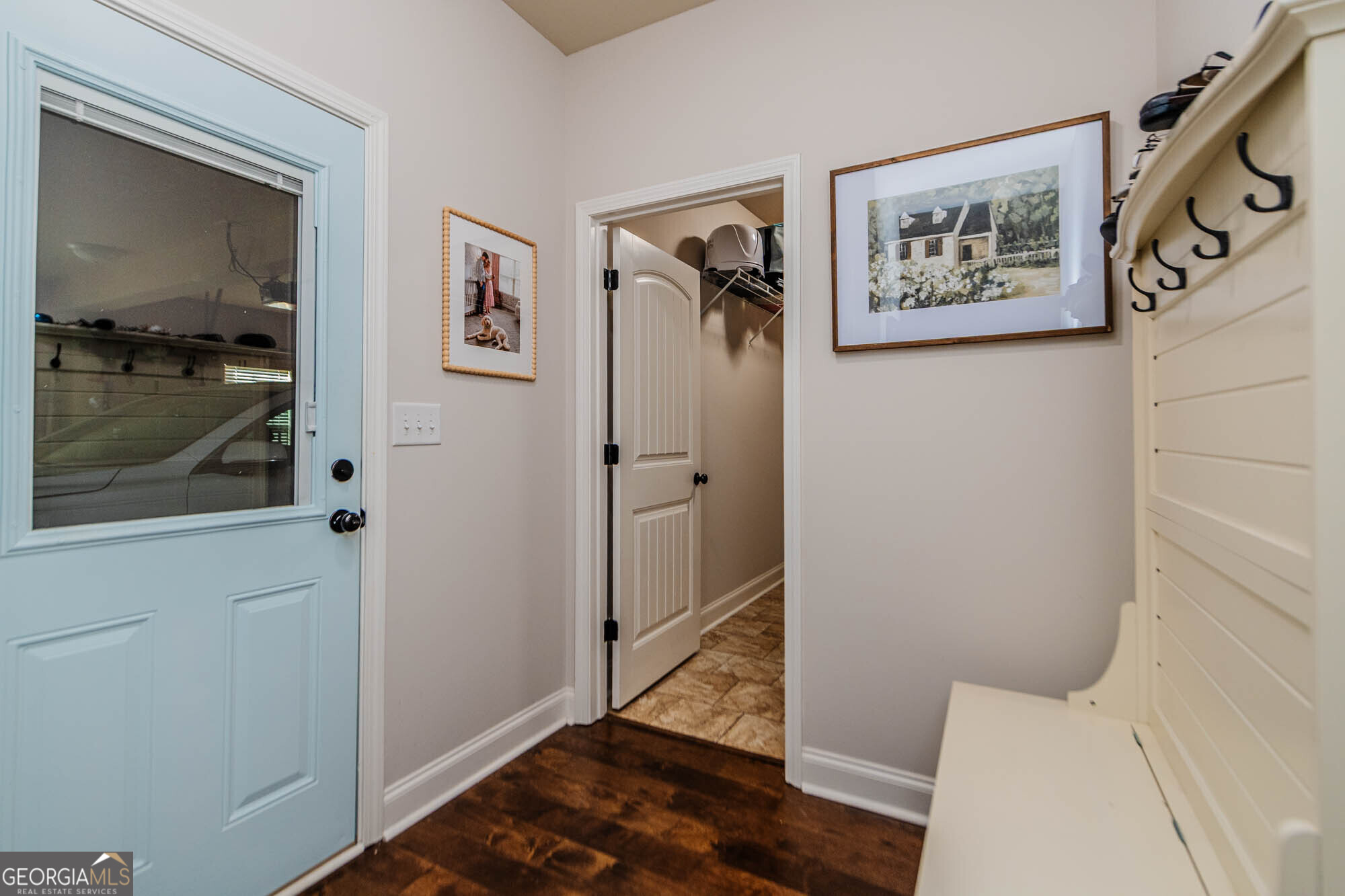 112 Bainbridge Lane Perry, GA 31069 - Photo 22 of 34 a view of a hallway with paintings on the wall