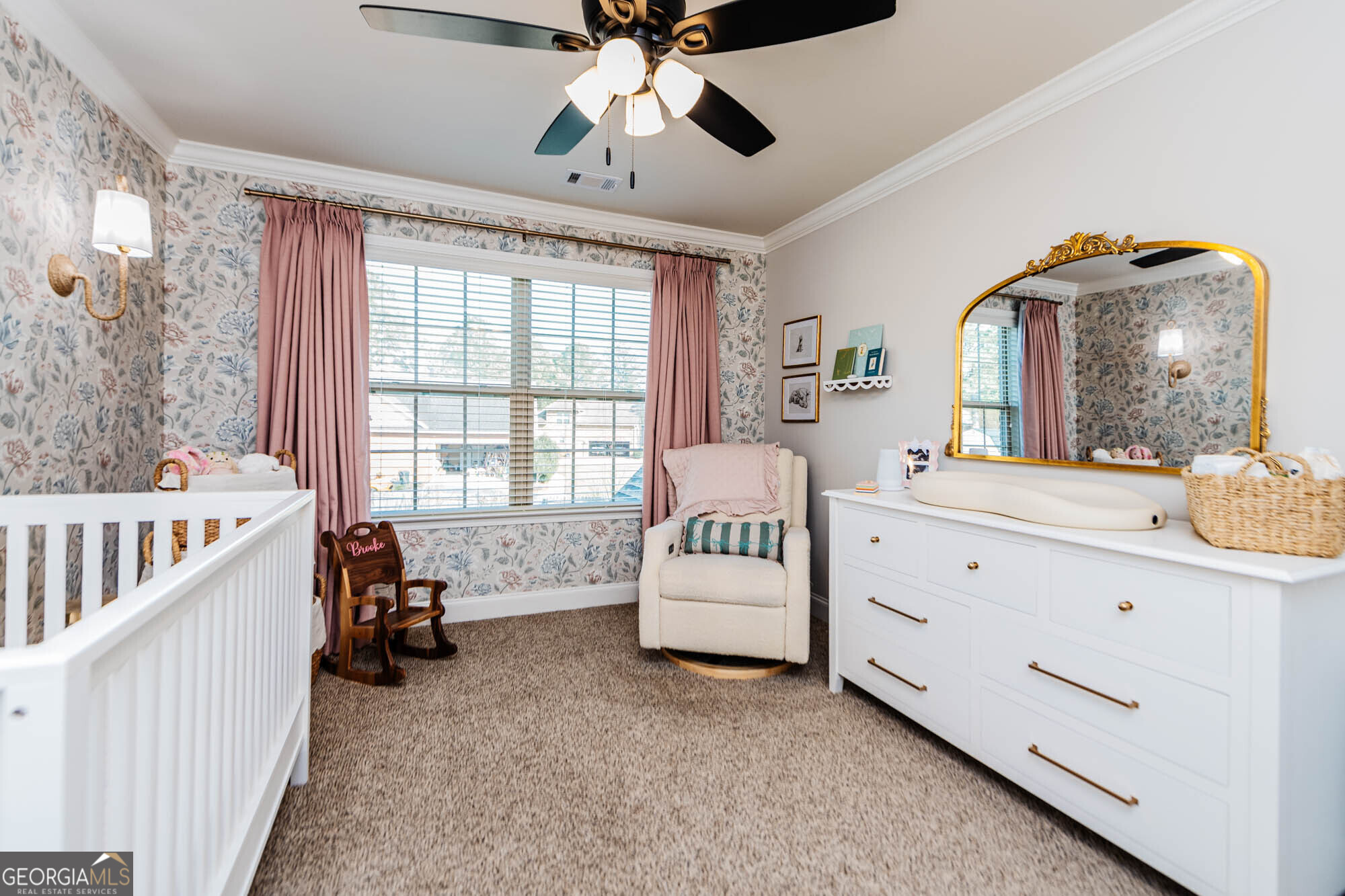 112 Bainbridge Lane Perry, GA 31069 - Photo 24 of 34 a spacious bedroom with a bed and a chandelier