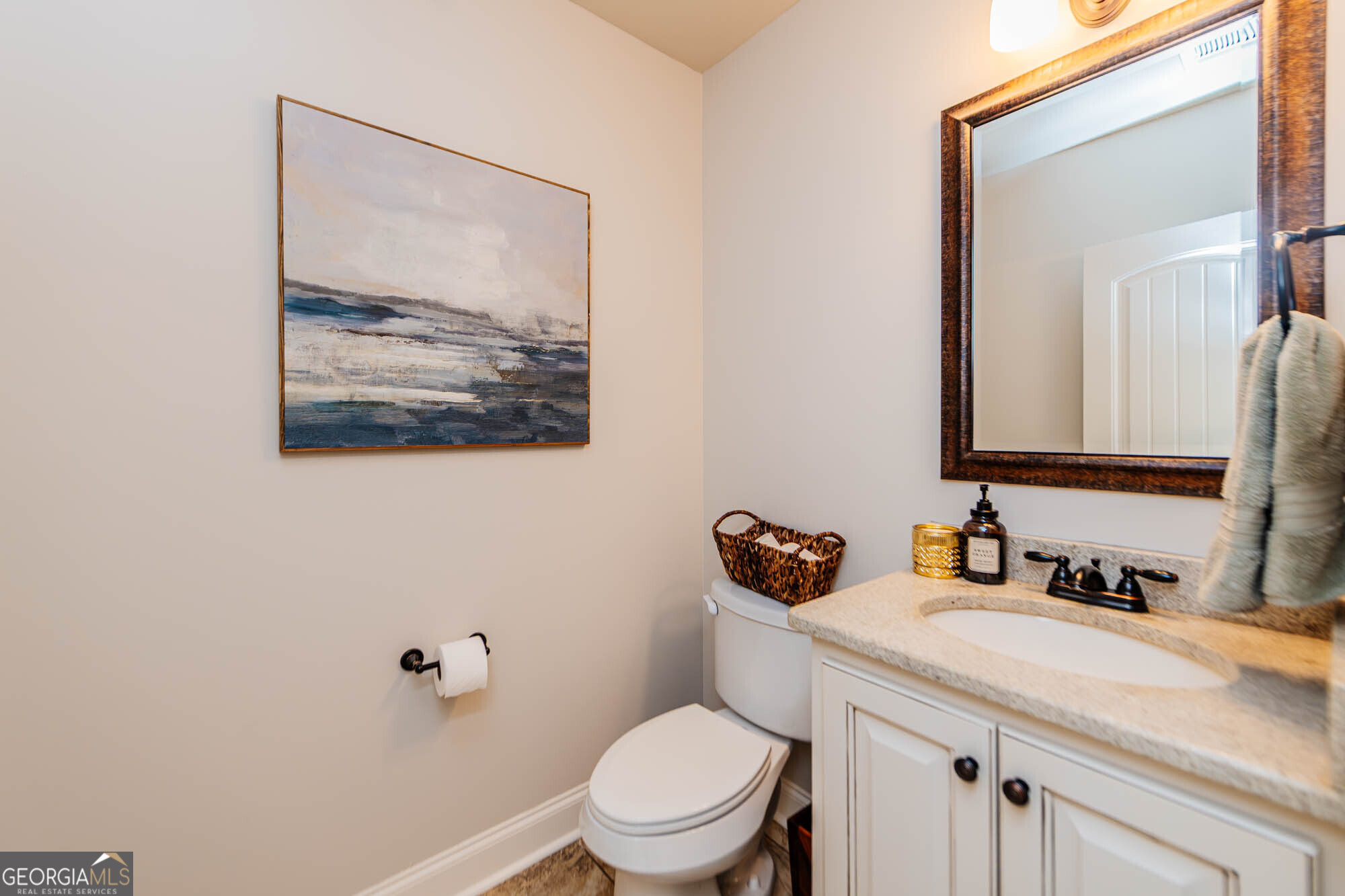 112 Bainbridge Lane Perry, GA 31069 - Photo 29 of 34 a bathroom with a toilet sink and mirror