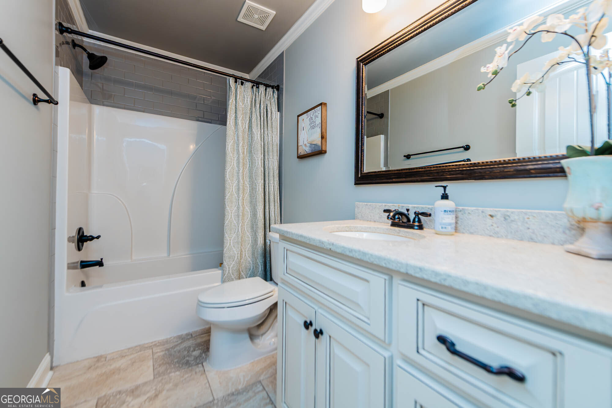 112 Bainbridge Lane Perry, GA 31069 - Photo 33 of 34 a bathroom with a sink a toilet and a mirror