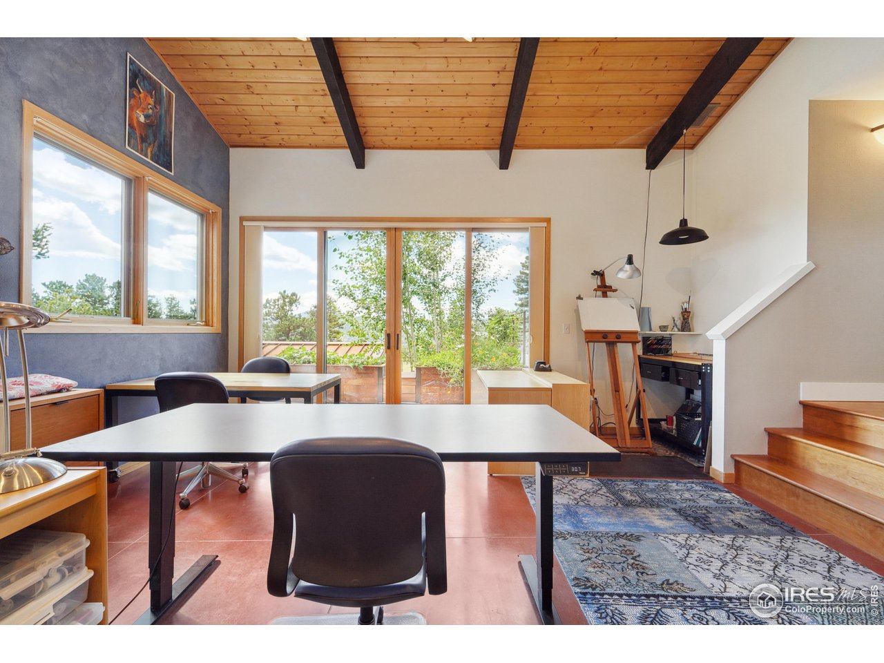 5055 Sugarloaf Road Boulder, CO 80302 - Photo 20 of 40 a view of a dining room with furniture window and outside view