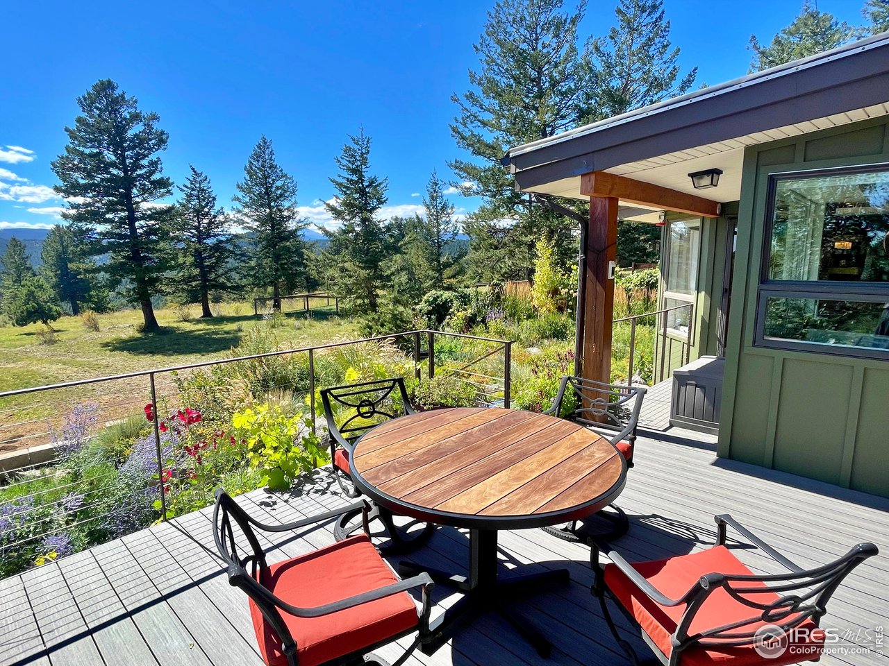 5055 Sugarloaf Road Boulder, CO 80302 - Photo 6 of 40 a view of a patio with a table chairs and a table